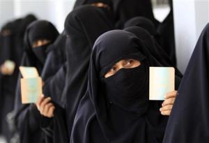 Women queue inside a polling station during presidential elections in Sanaa